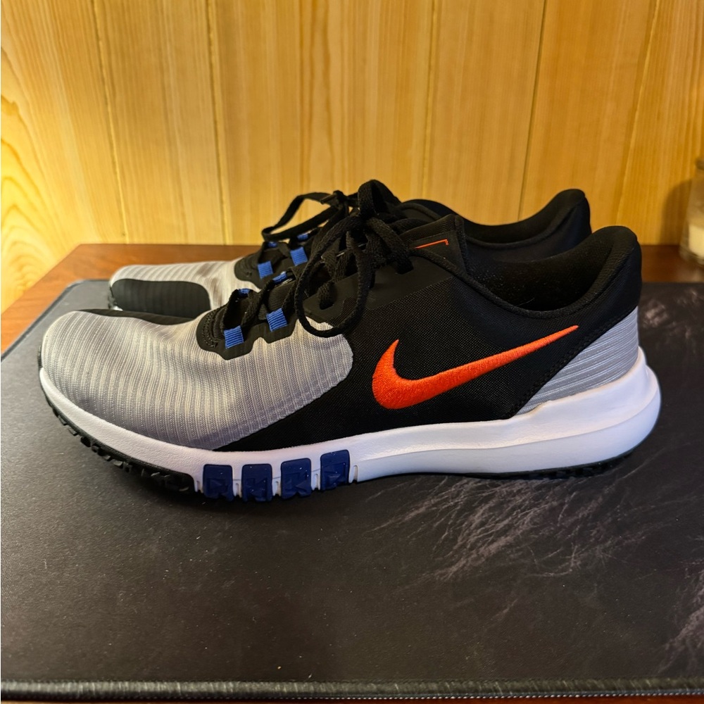 Nike Black and Gray Trainers with Vibrant Orange Logo